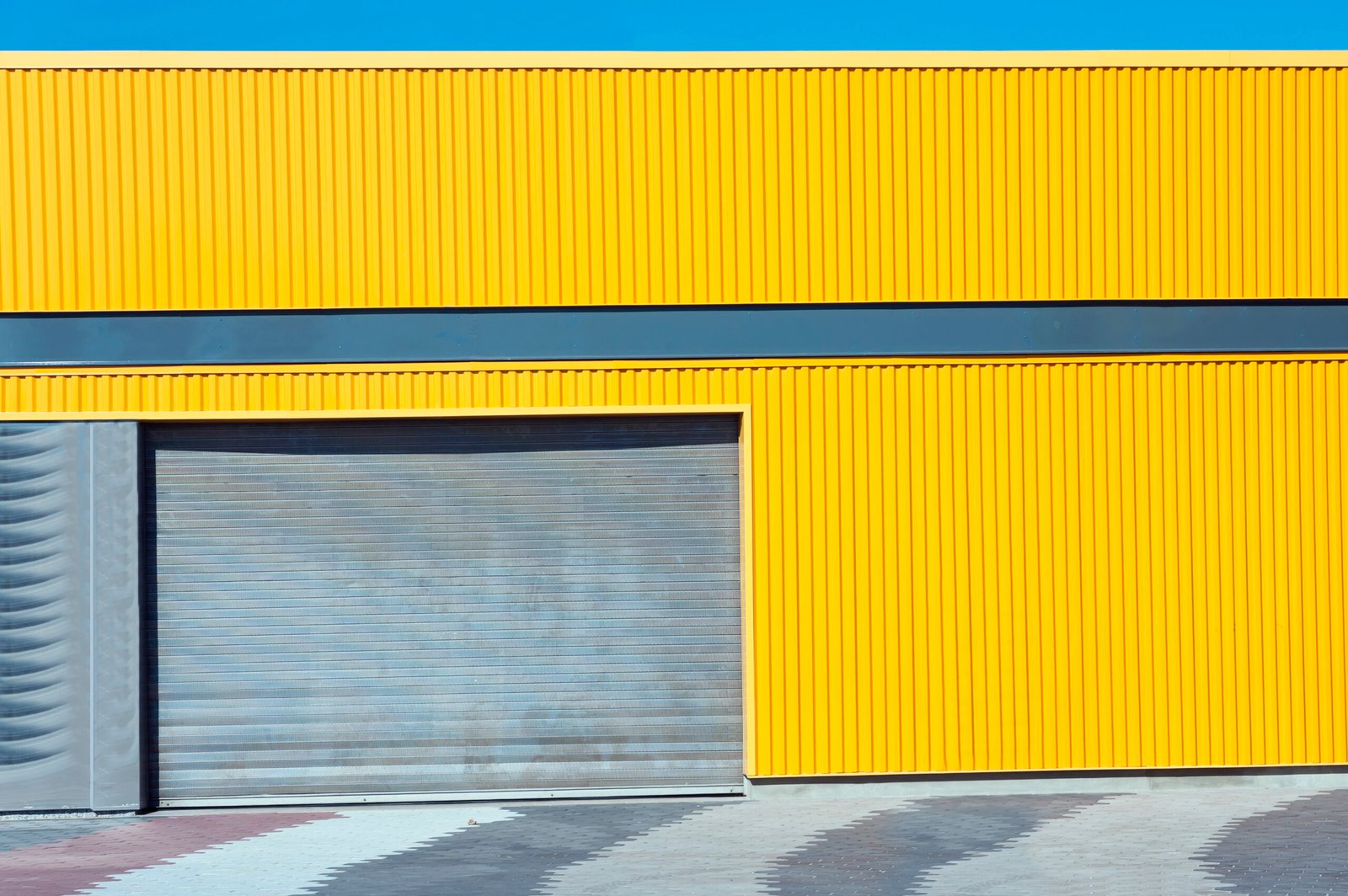 New Modern Garage Door in Unfinish Exterior Yellow Metal Wall